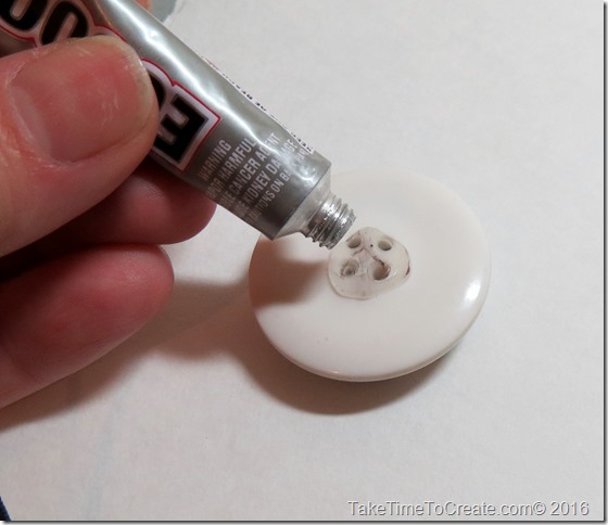 Glue on the back of button